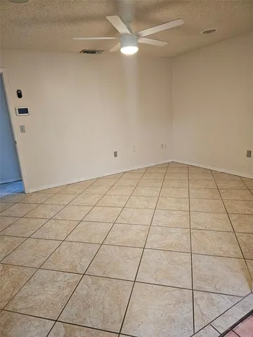 a view of a room with an empty space and a sink