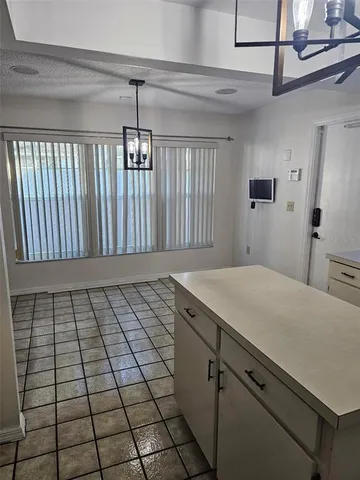 a view of a kitchen that has a sink and a stove top oven