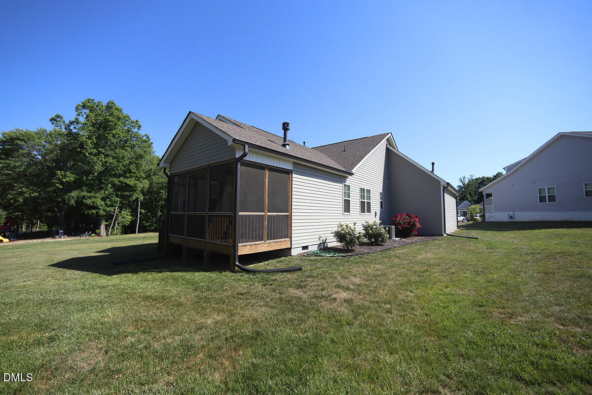 125 Mae Court Roxboro, NC 27573 - Photo 28 of 30 a view of a house with backyard and garden
