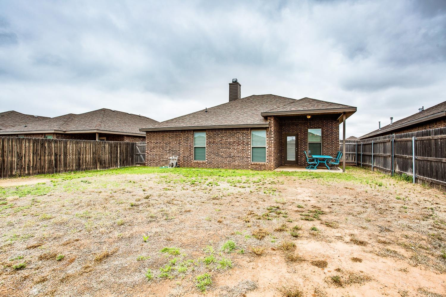 7428 103rd Street Lubbock, TX 79424 - Photo 17 of 18 Spacious backyard w/ Covered Patio
