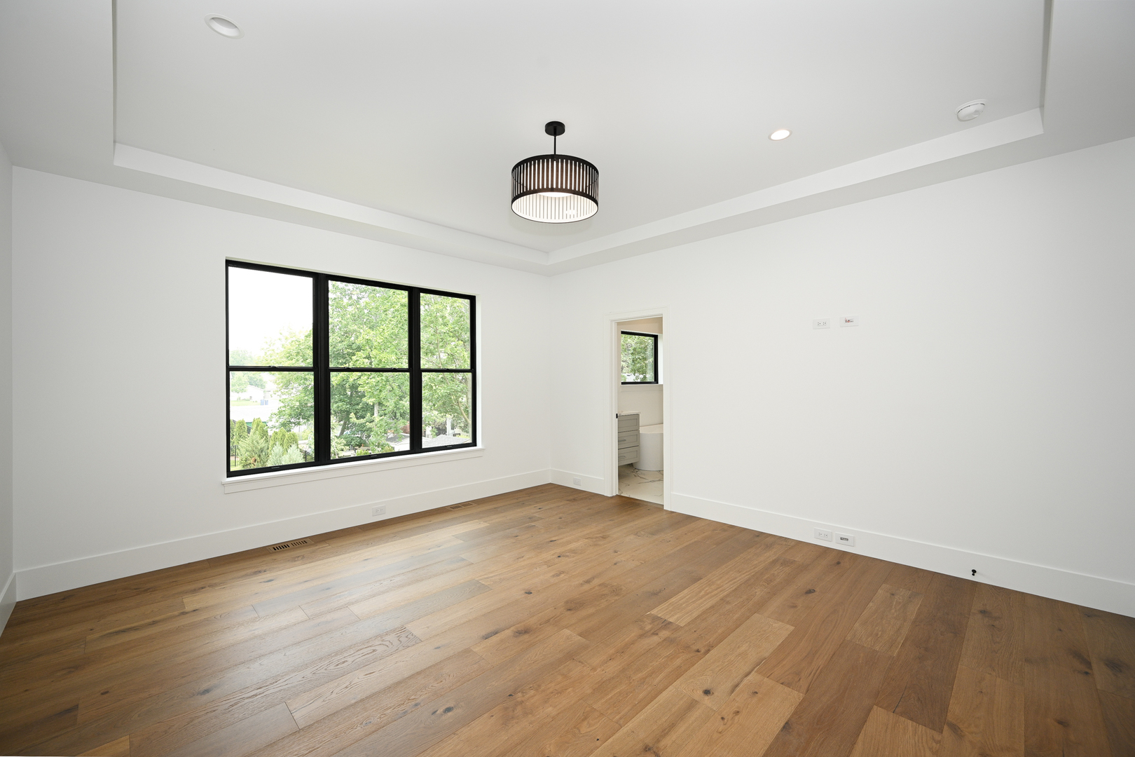 64 Miller Road Lake Zurich, IL 60047 - Photo 18 of 28 an empty room with wooden floor and windows