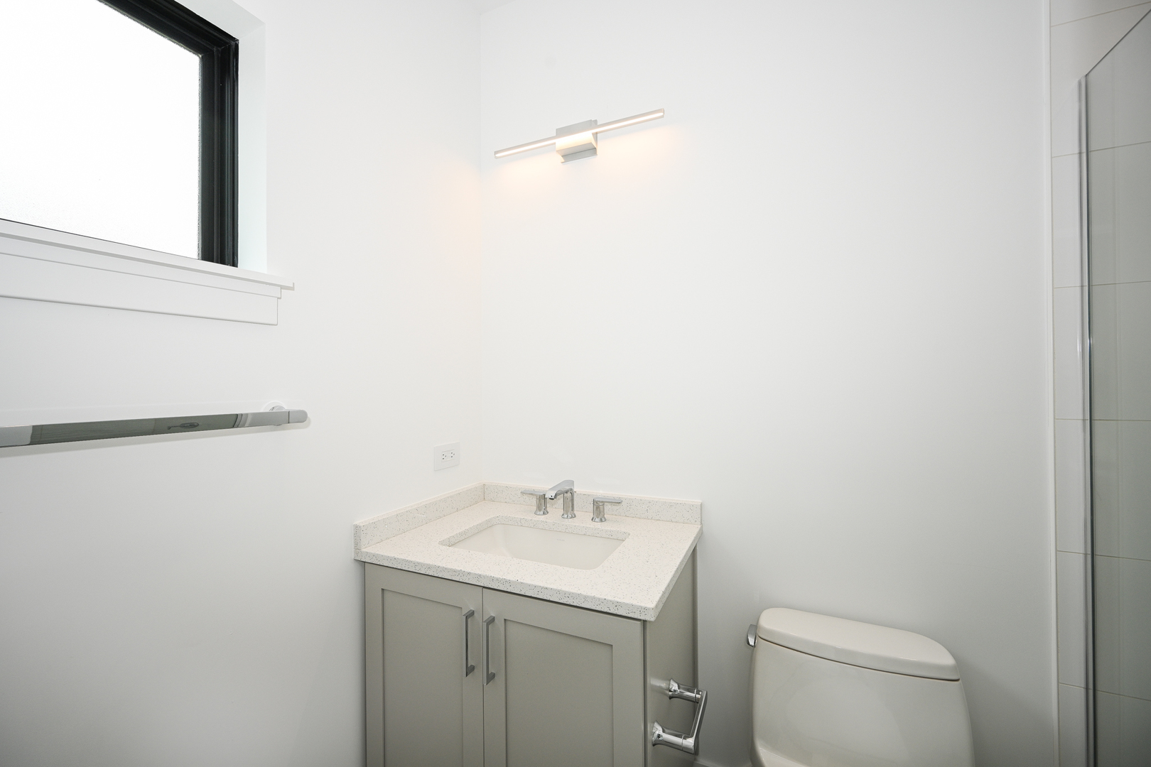 64 Miller Road Lake Zurich, IL 60047 - Photo 27 of 28 a bathroom with a sink a toilet and a mirror
