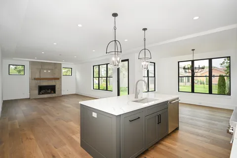 a kitchen with sink and window