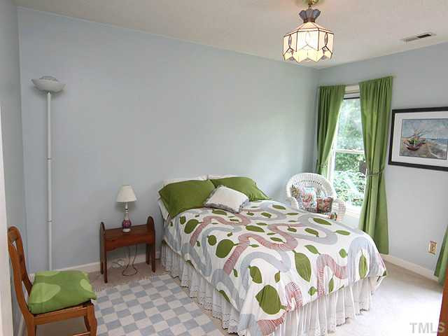 8616 Harbor Drive Raleigh, NC 27615 - Photo 14 of 25 Bedroom 12.7x10.0 with Decorative Light Fixture. Bedroom