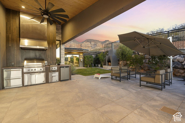 3652 South Cypress Road Hurricane, UT 84737 - Photo 77 of 81 Outdoor kitchen featuring a built-in grill, stainless steel appliances, and integrated hood vent
