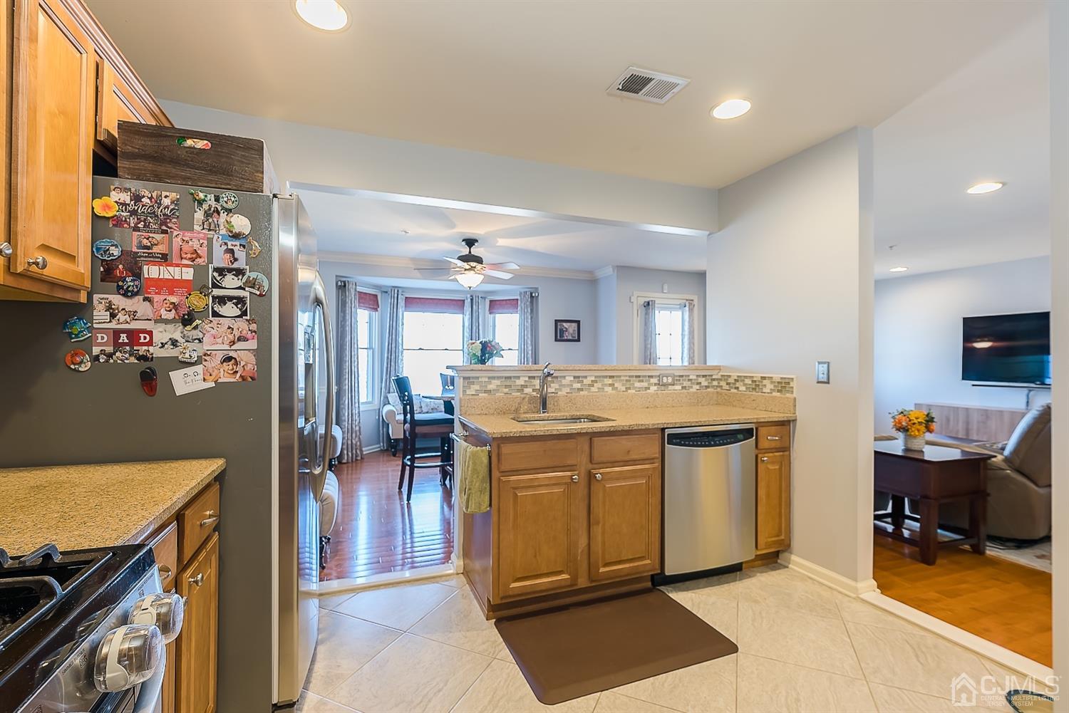 48 Raritan Reach Road South Amboy, NJ 08879 - Photo 11 of 23 a kitchen with stainless steel appliances granite countertop a stove and a refrigerator
