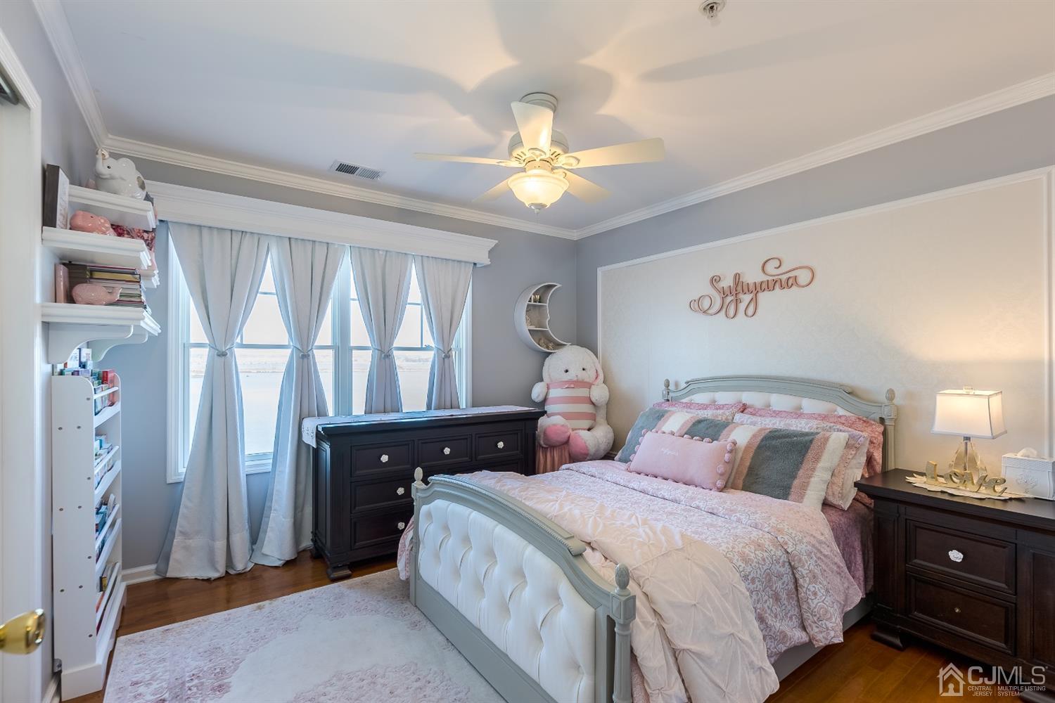 48 Raritan Reach Road South Amboy, NJ 08879 - Photo 16 of 23 a bedroom with a bed and a chandelier