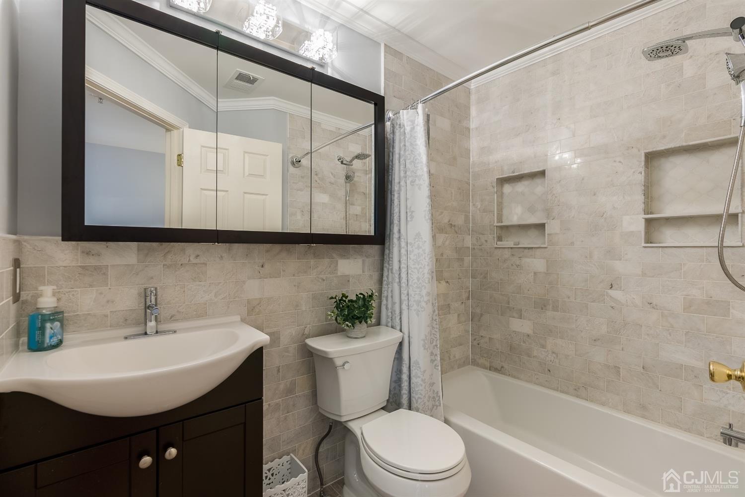 48 Raritan Reach Road South Amboy, NJ 08879 - Photo 17 of 23 a bathroom with a sink a toilet and shower