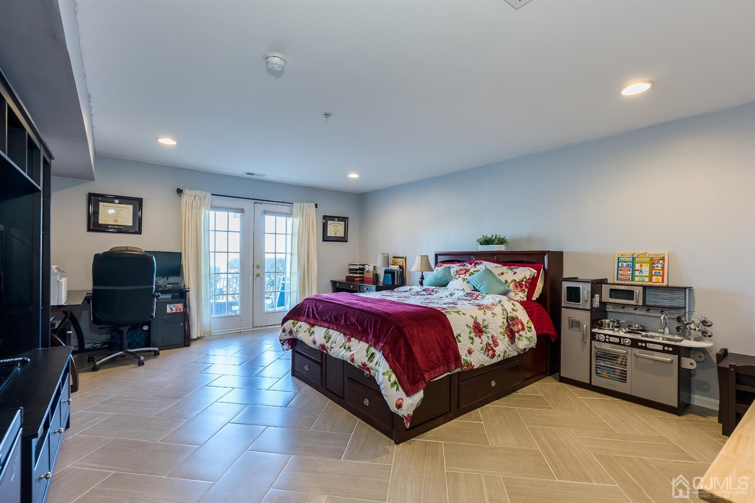 48 Raritan Reach Road South Amboy, NJ 08879 - Photo 19 of 23 a spacious bedroom with a bed and a tv