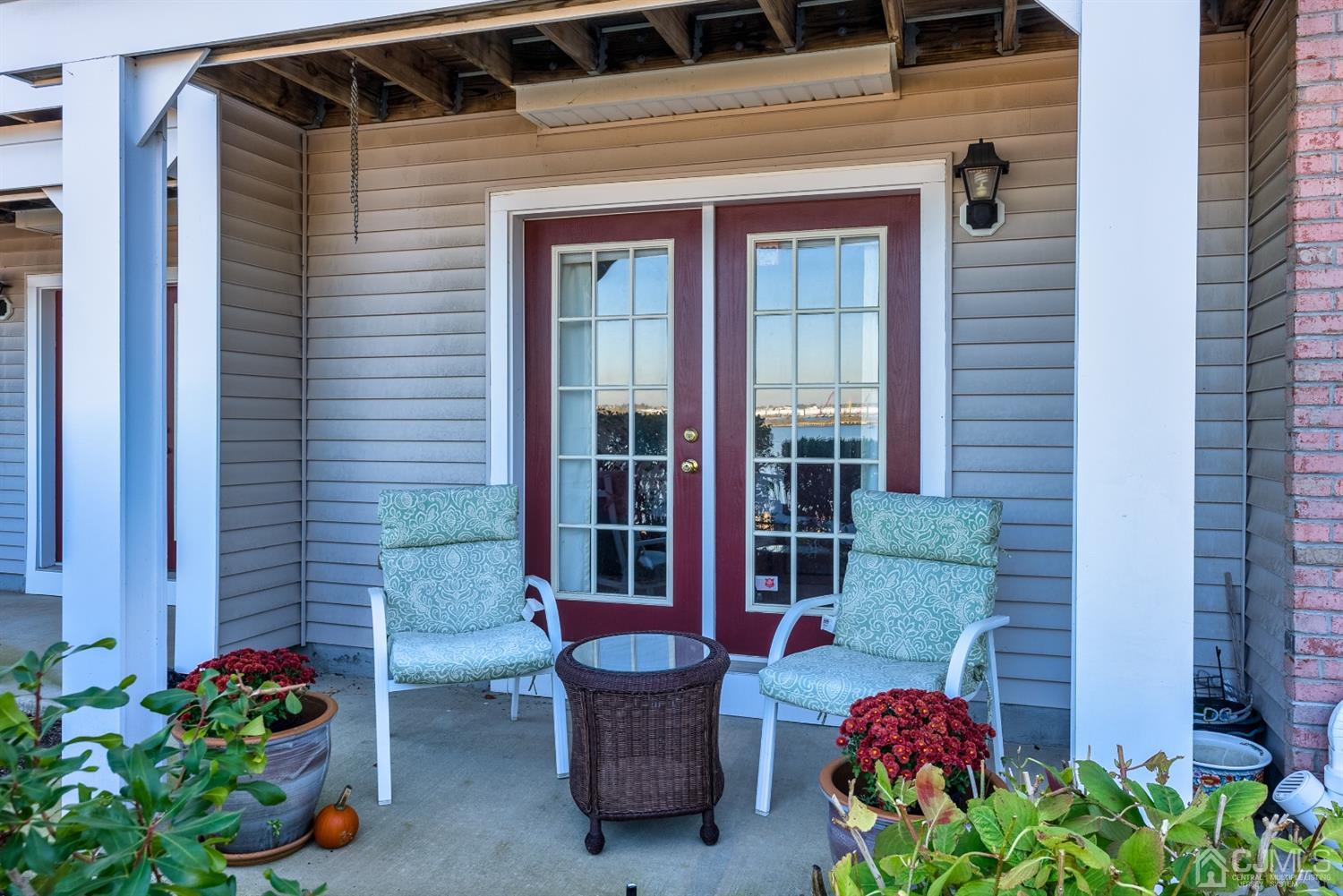 48 Raritan Reach Road South Amboy, NJ 08879 - Photo 20 of 23 a front view of a house with outdoor seating and flowers