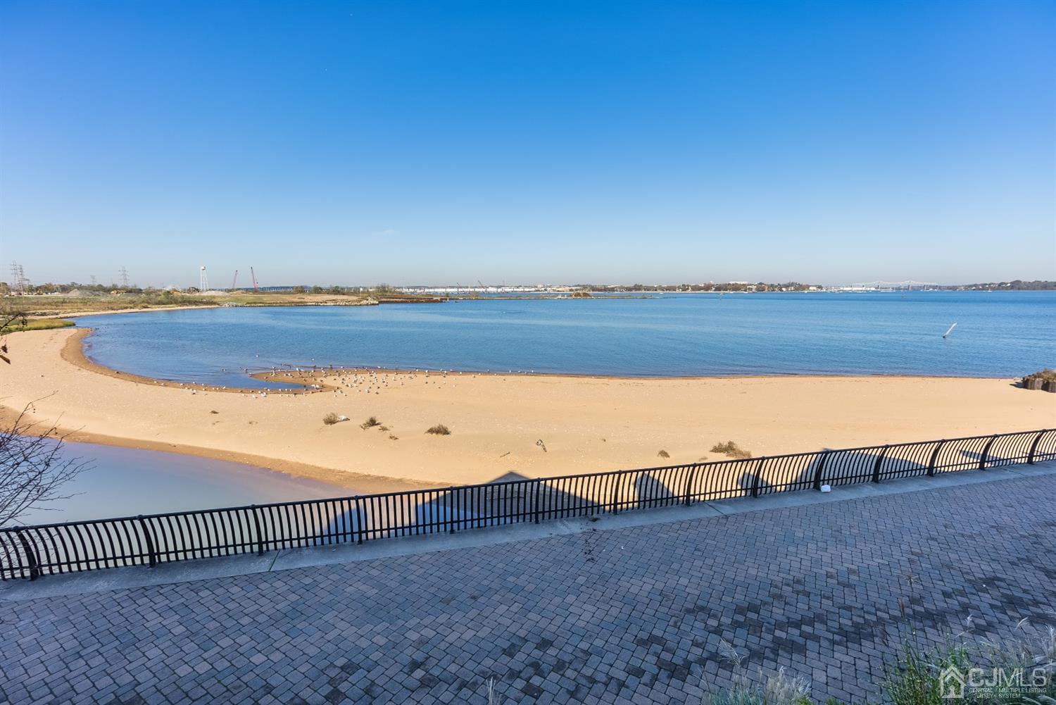 48 Raritan Reach Road South Amboy, NJ 08879 - Photo 23 of 23 a view of a lake with a beach