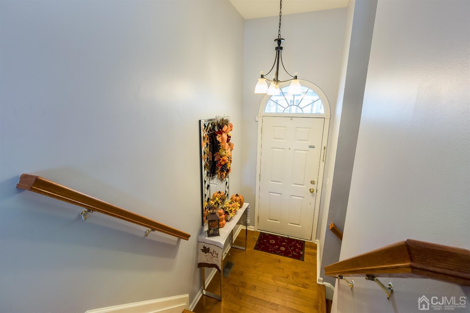 48 Raritan Reach Road South Amboy, NJ 08879 - Photo 4 of 23 a hallway with table and dryer