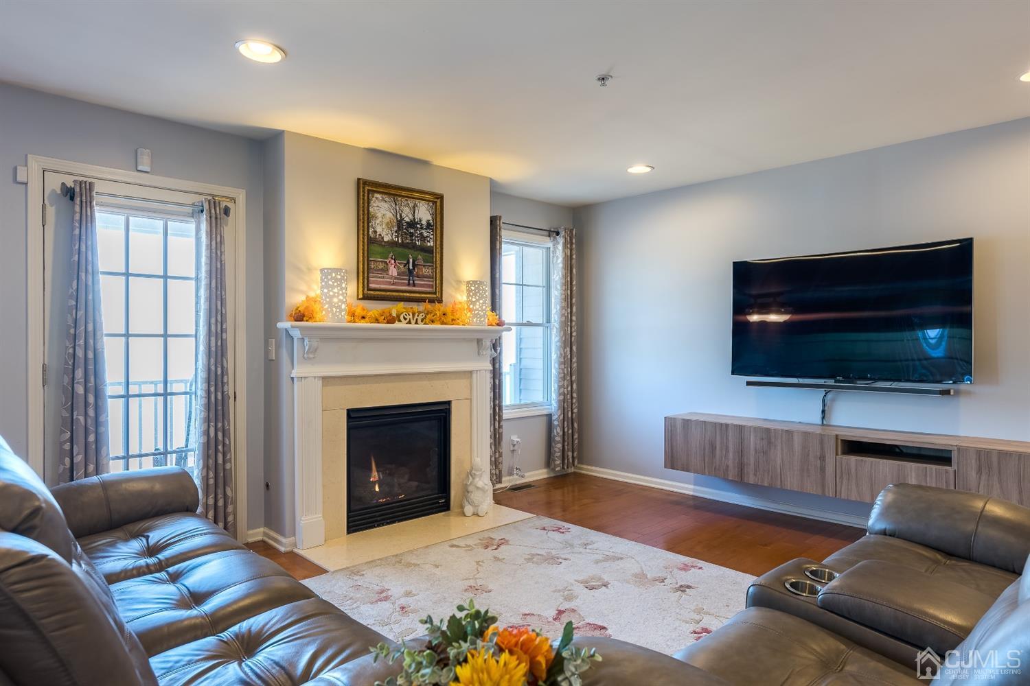 48 Raritan Reach Road South Amboy, NJ 08879 - Photo 7 of 23 a living room with a flat screen tv and a fireplace