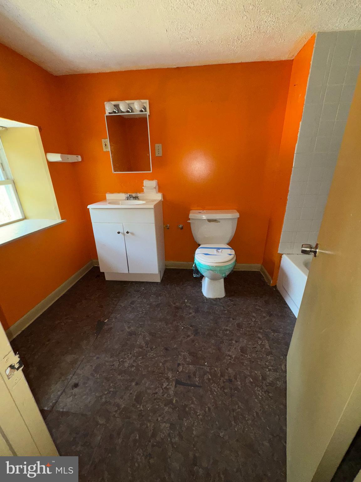 3003 Lyttleton Road Baltimore, MD 21216 - Photo 17 of 27 a bathroom with a toilet and a sink
