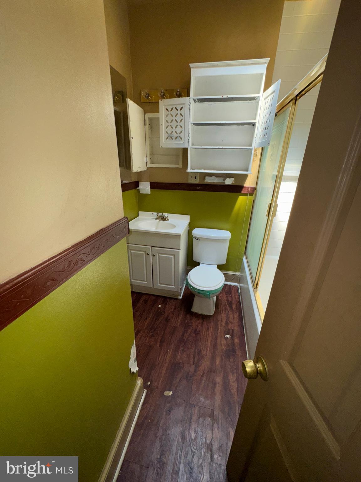3003 Lyttleton Road Baltimore, MD 21216 - Photo 21 of 27 a view of bathroom with a toilet and a sink