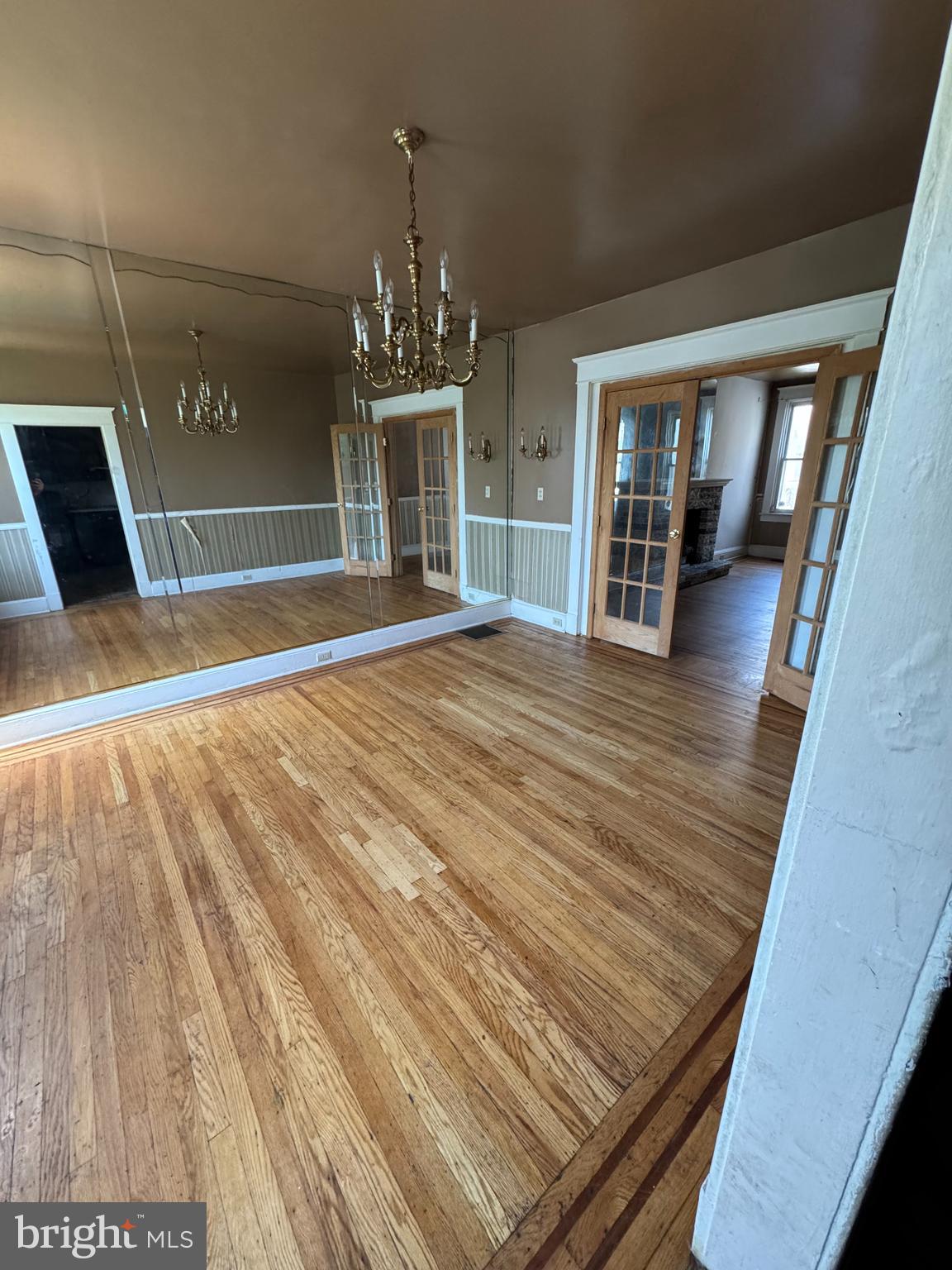 3003 Lyttleton Road Baltimore, MD 21216 - Photo 8 of 27 a view of empty room with wooden floor and fan