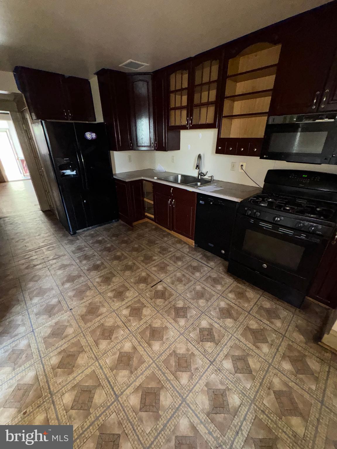 3003 Lyttleton Road Baltimore, MD 21216 - Photo 9 of 27 a kitchen with a cabinets and appliances