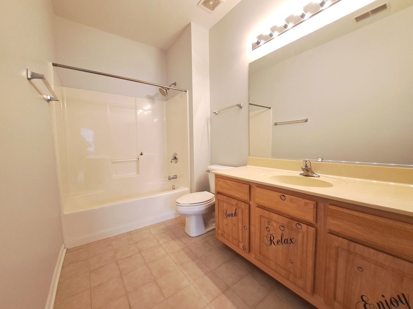 1307 West Lake Street, Unit 304 Addison, IL 60101 - Photo 16 of 33 a spacious bathroom with a double vanity sink toilet mirror and bathtub