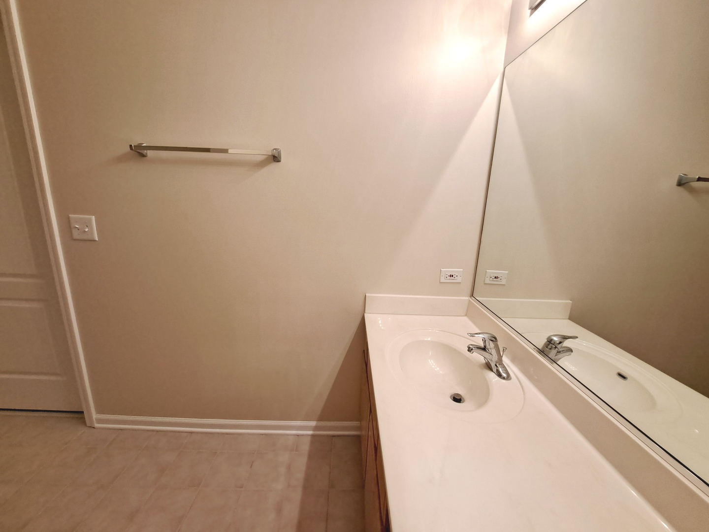1307 West Lake Street, Unit 304 Addison, IL 60101 - Photo 22 of 33 a bathroom with a sink and mirror