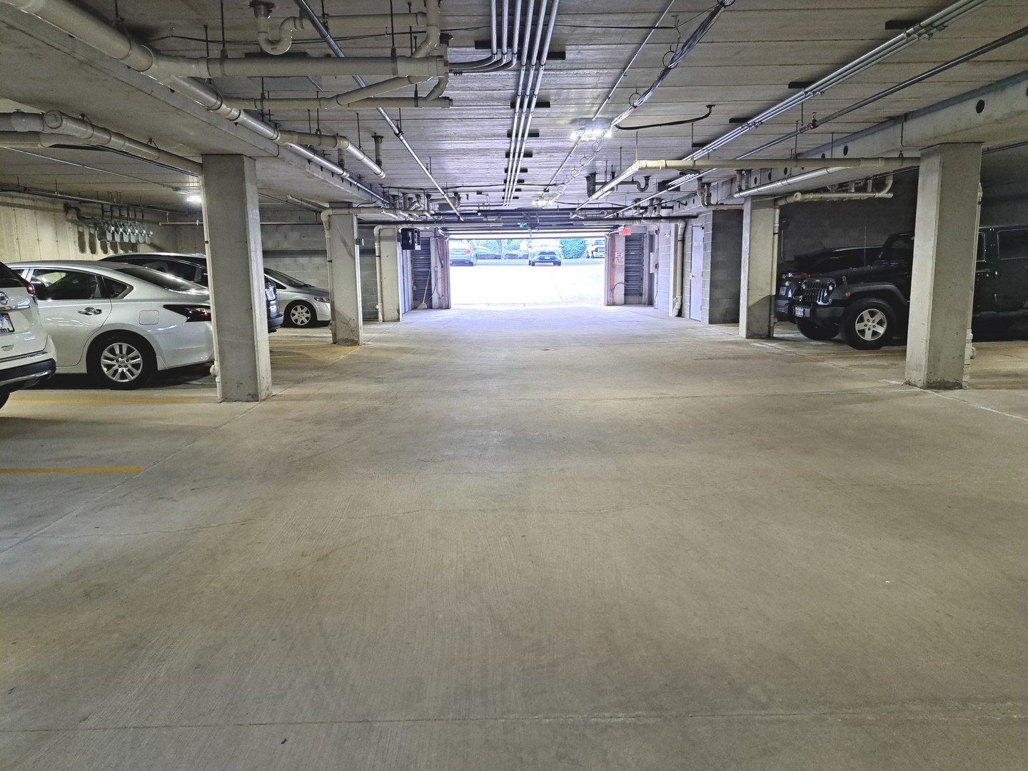 1307 West Lake Street, Unit 304 Addison, IL 60101 - Photo 29 of 33 a view of parking garage with cars
