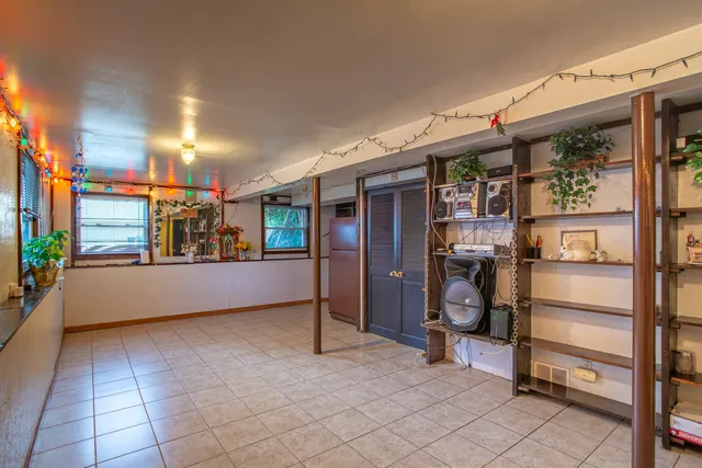 a view of water heater room with stairs
