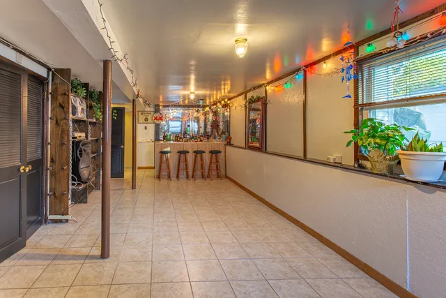 a view of a chairs and table in the balcony