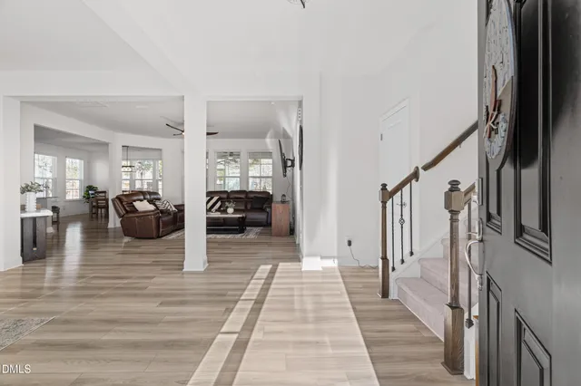 a living room with furniture or couch and a wooden floor