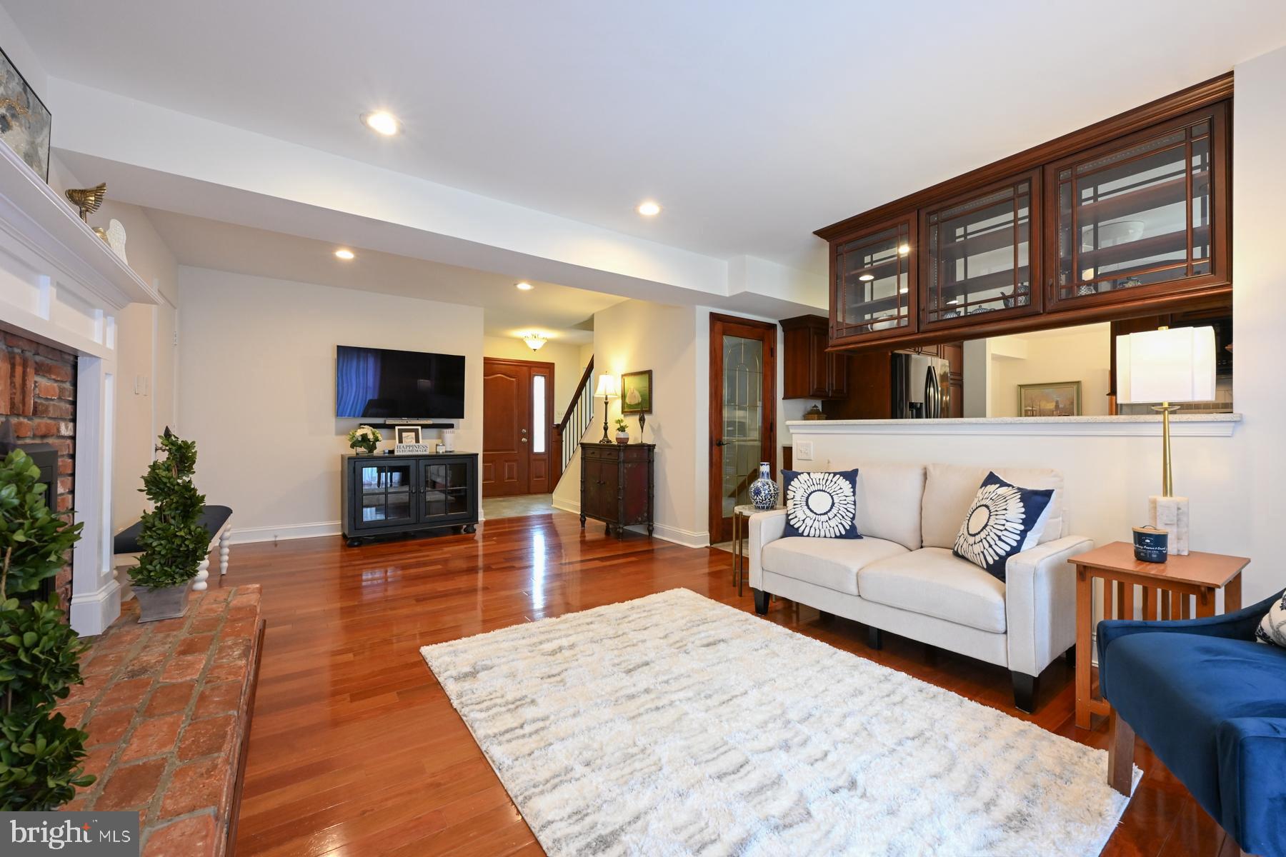 8329 Sail Court Pasadena, MD 21122 - Photo 18 of 61 a living room with furniture and a flat screen tv
