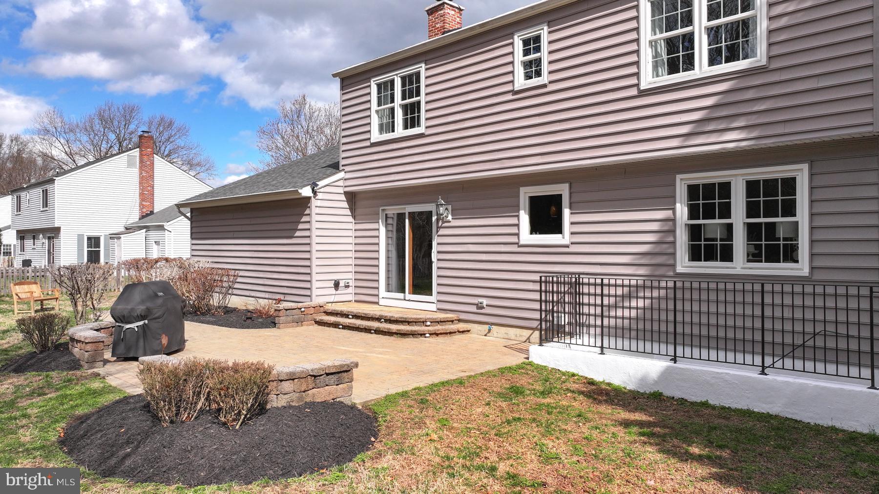 8329 Sail Court Pasadena, MD 21122 - Photo 20 of 61 a backyard of a house with fire pit and chairs