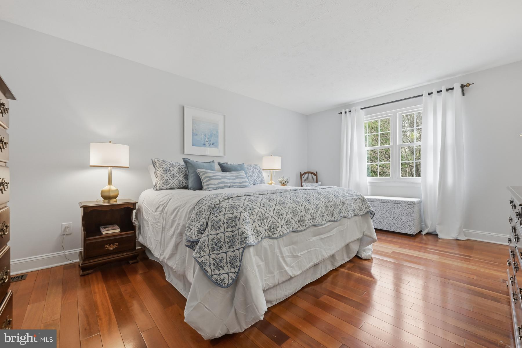 8329 Sail Court Pasadena, MD 21122 - Photo 23 of 61 a bedroom with a bed and wooden floor