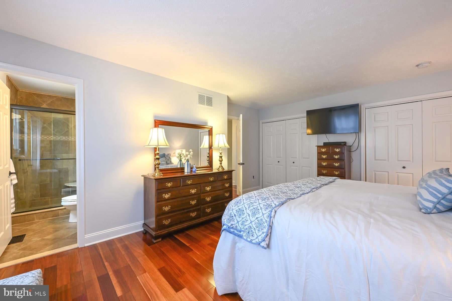 8329 Sail Court Pasadena, MD 21122 - Photo 24 of 61 a bedroom with a bed and a dresser