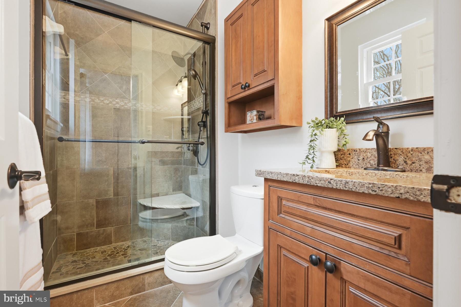 8329 Sail Court Pasadena, MD 21122 - Photo 25 of 61 a bathroom with a granite countertop sink toilet and shower
