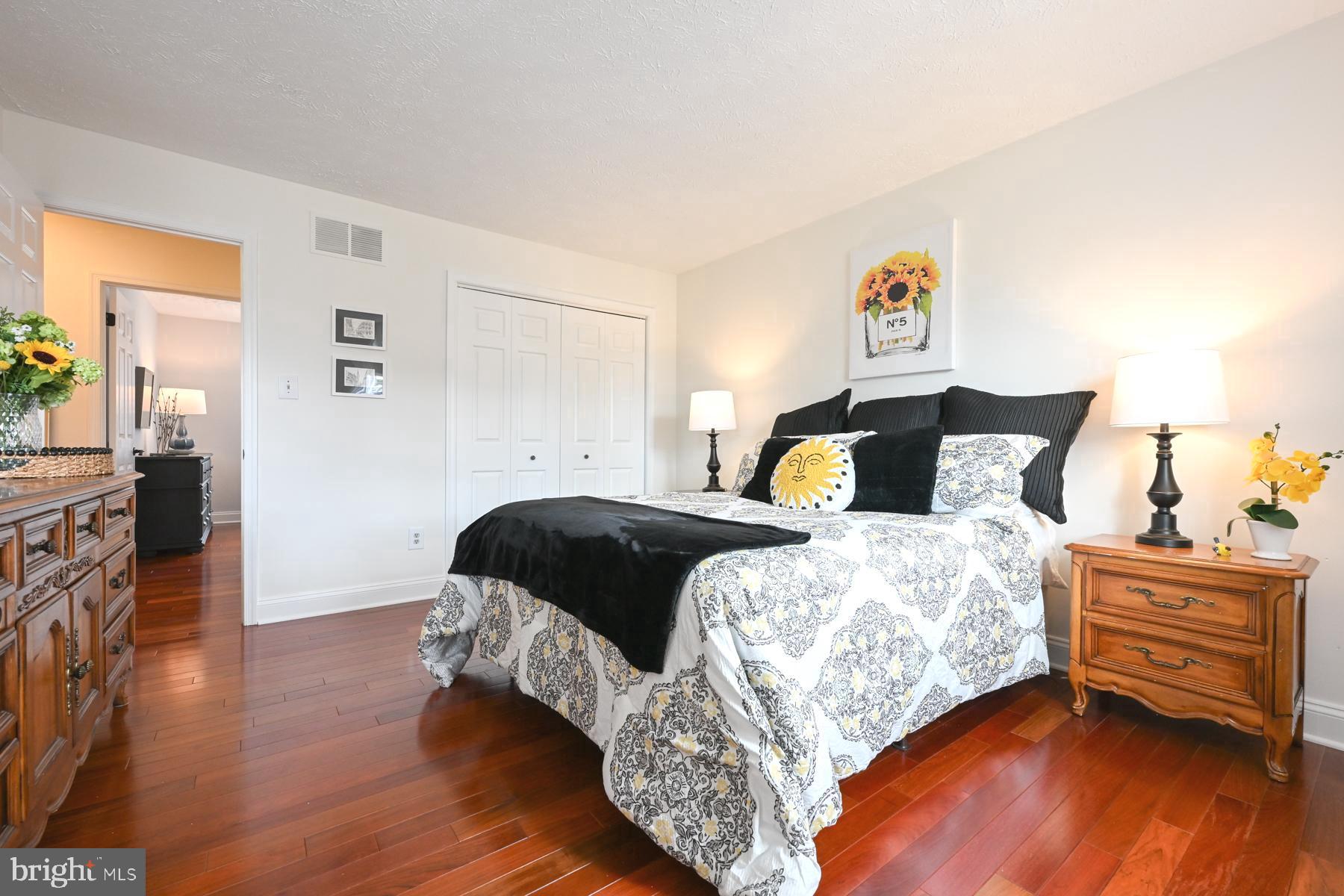 8329 Sail Court Pasadena, MD 21122 - Photo 28 of 61 a bedroom with a bed and wooden floor