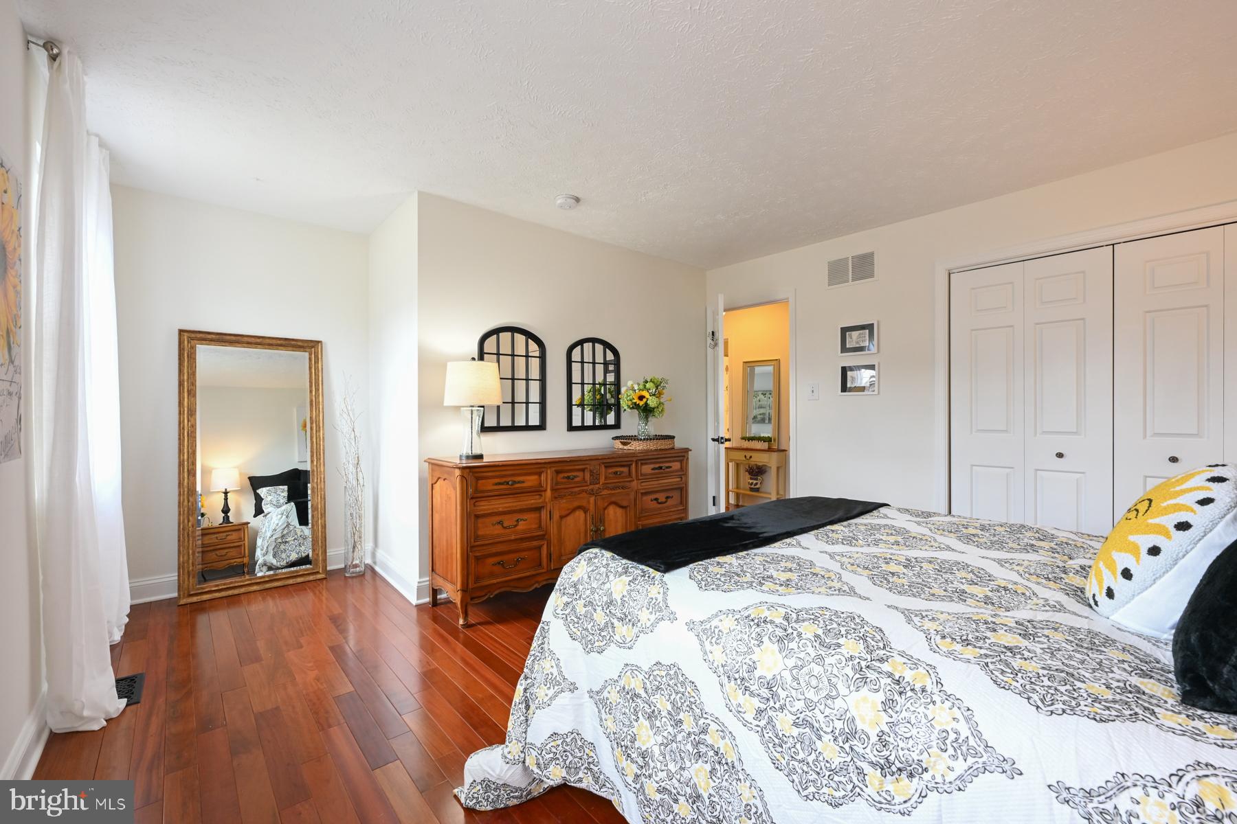 8329 Sail Court Pasadena, MD 21122 - Photo 29 of 61 a bedroom with a bed and a dresser in it