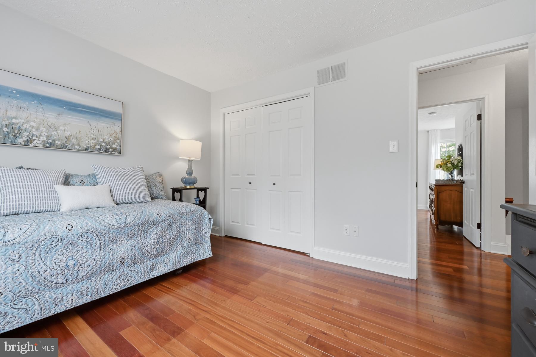 8329 Sail Court Pasadena, MD 21122 - Photo 33 of 61 a bedroom with a bed and wooden floor