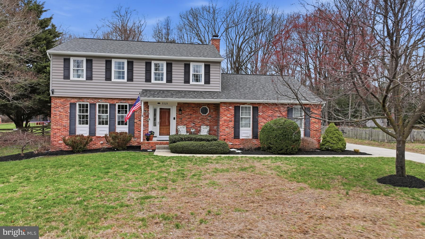 8329 Sail Court Pasadena, MD 21122 - Photo 52 of 61 a front view of a house with garden and porch