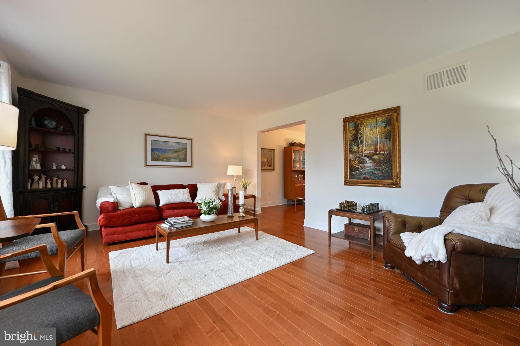 8329 Sail Court Pasadena, MD 21122 - Photo 6 of 61 a living room with furniture and wooden floor