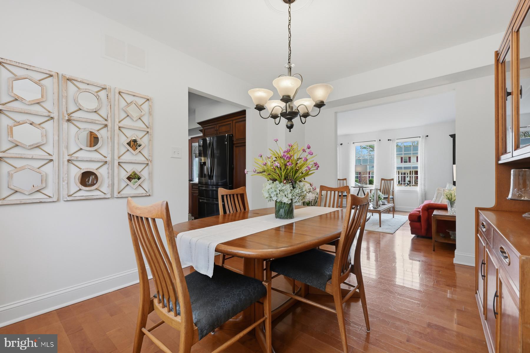 8329 Sail Court Pasadena, MD 21122 - Photo 9 of 61 a view of a dining room with furniture and chandelier