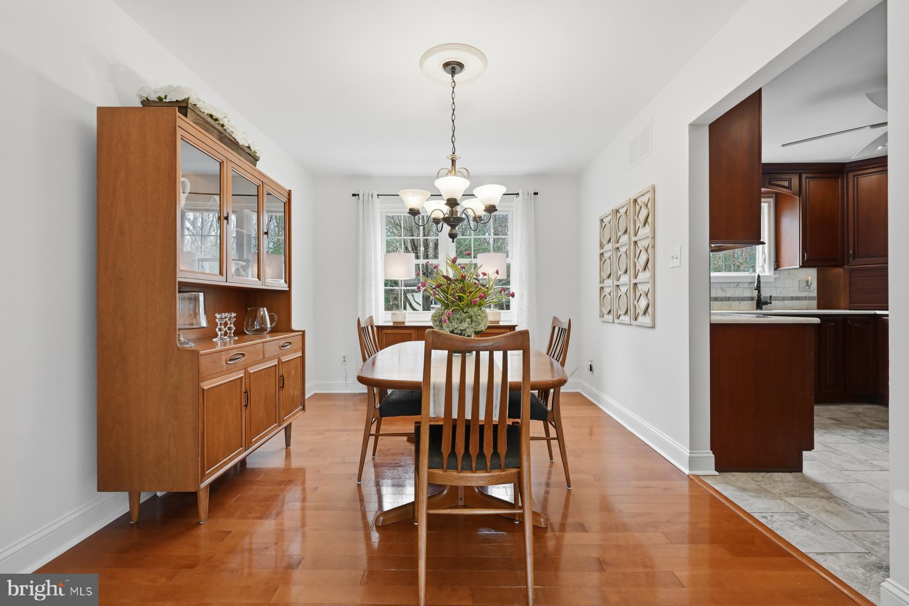 8329 Sail Court Pasadena, MD 21122 - Photo 10 of 61 a view of a dining room with furniture window and wooden floor