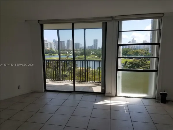 a view of a room with a large window