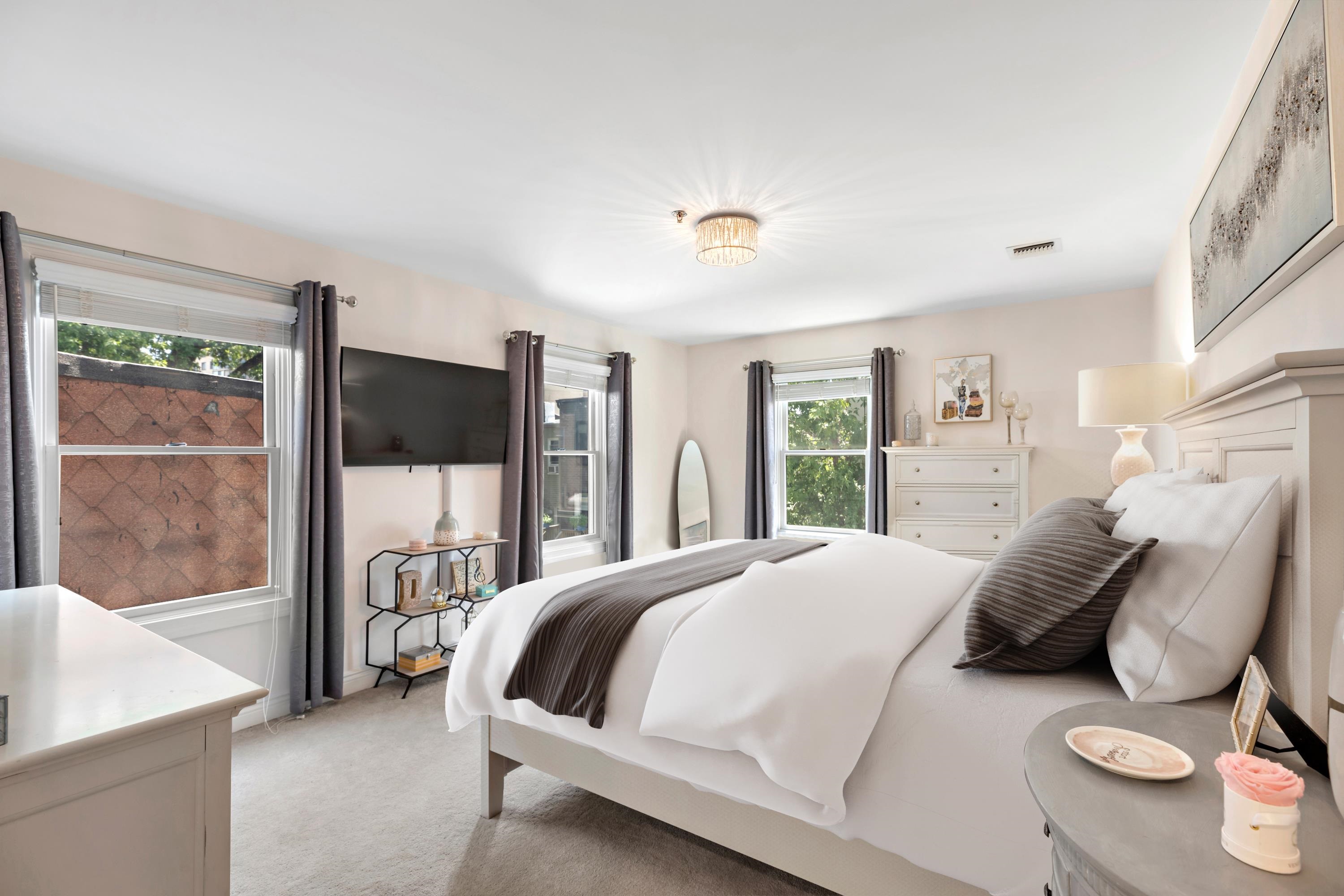 137 20th Street, Unit B Union City, NJ 07087 - Photo 12 of 33 a bedroom with a bed and large window