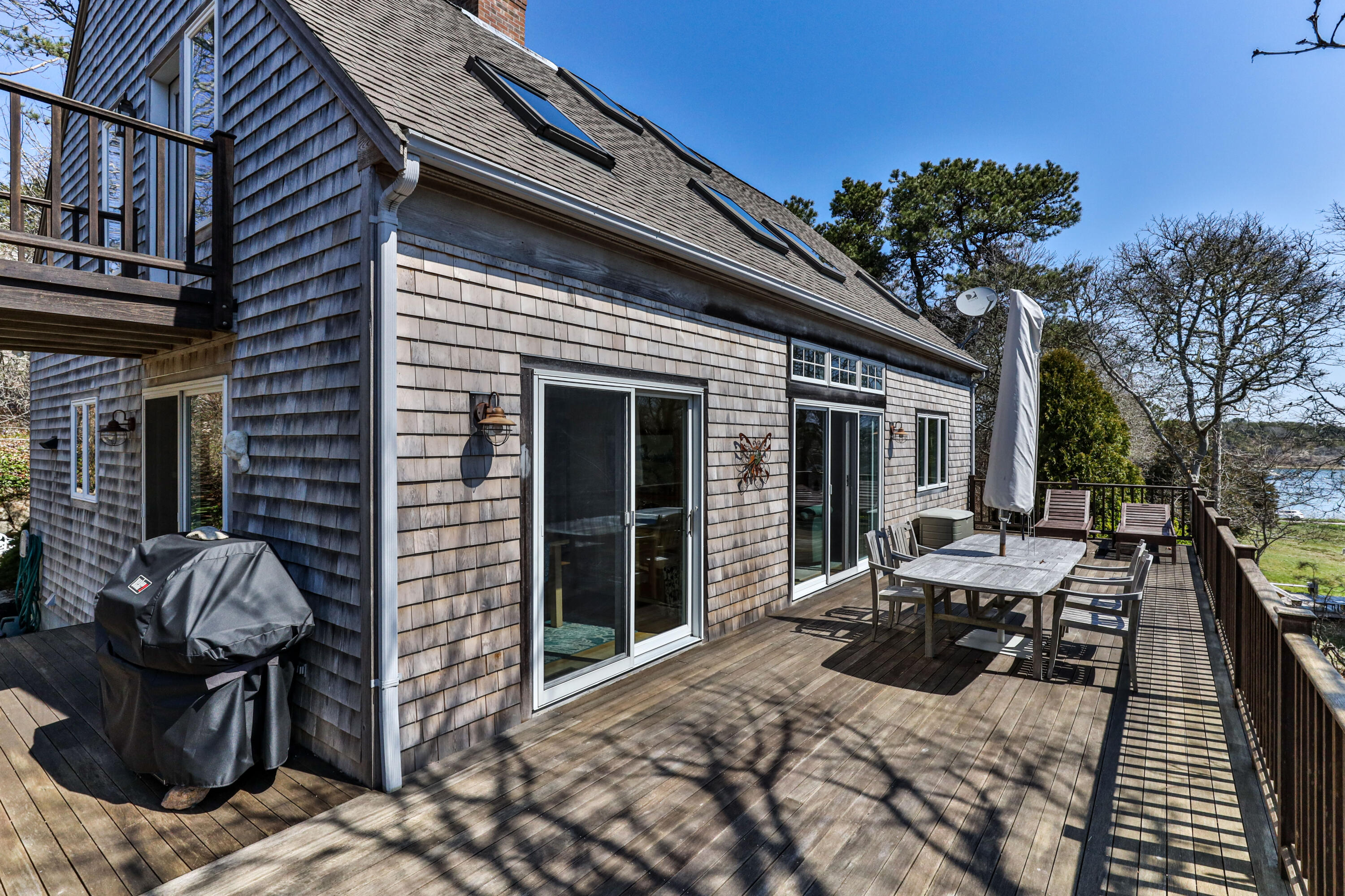 38 Crosswind Farm Road Chatham, MA 02633 - Photo 21 of 36 a view of a patio with chairs and potted plants