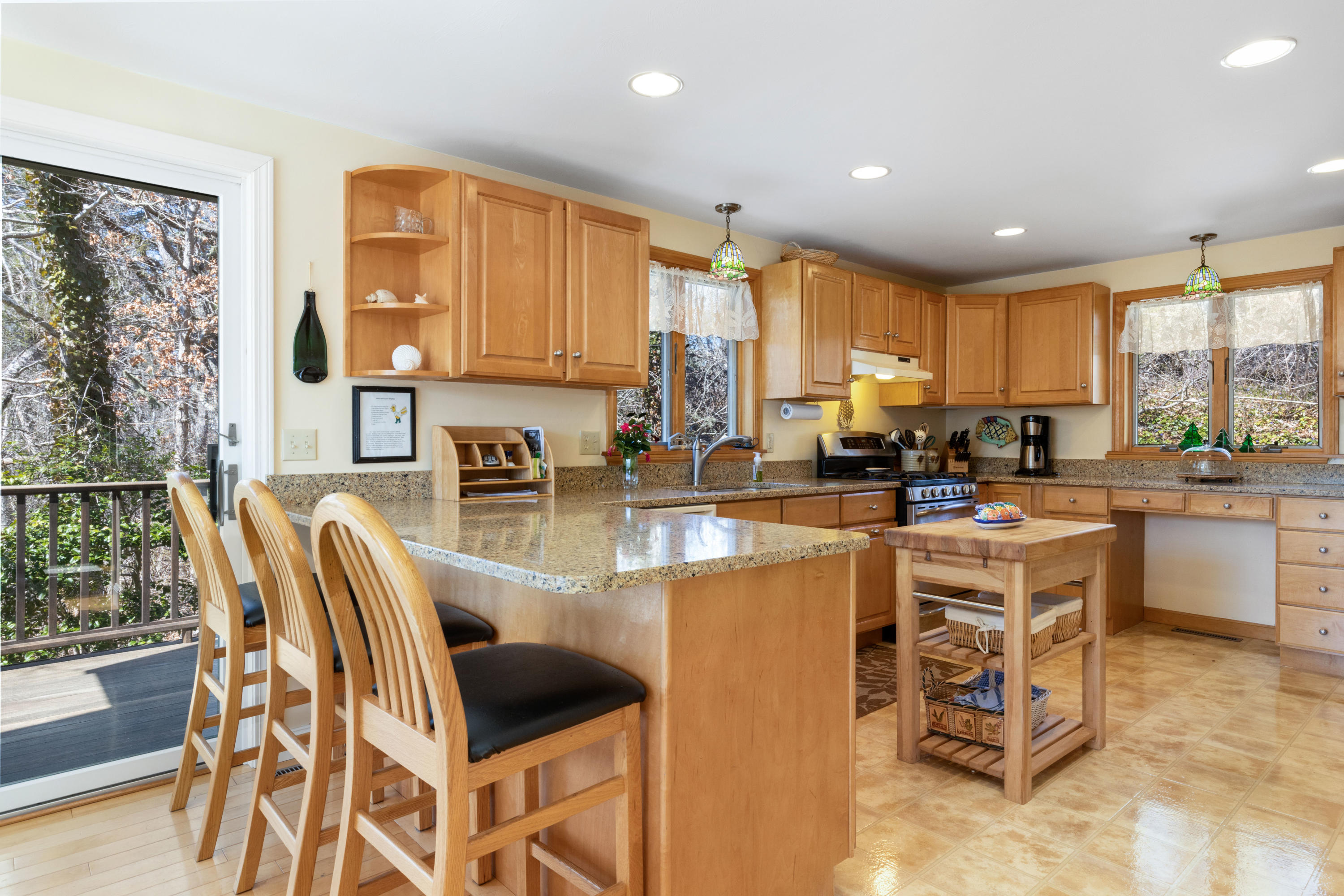 38 Crosswind Farm Road Chatham, MA 02633 - Photo 8 of 36 a kitchen with a dining table chairs and a view of living room