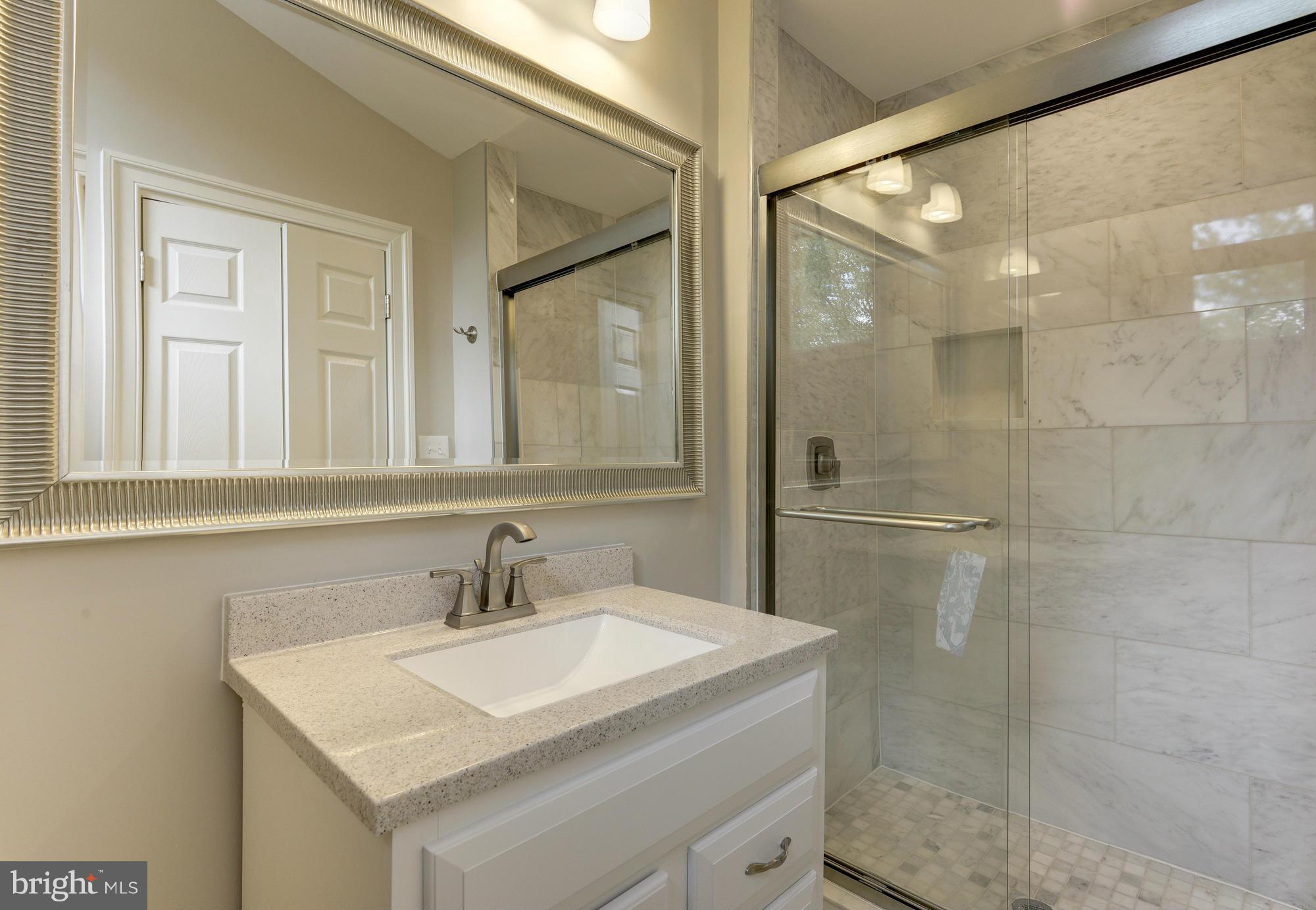 2237 Cartwright Place Reston, VA 20191 - Photo 14 of 25 Carrara marble master with large shower w/ bench