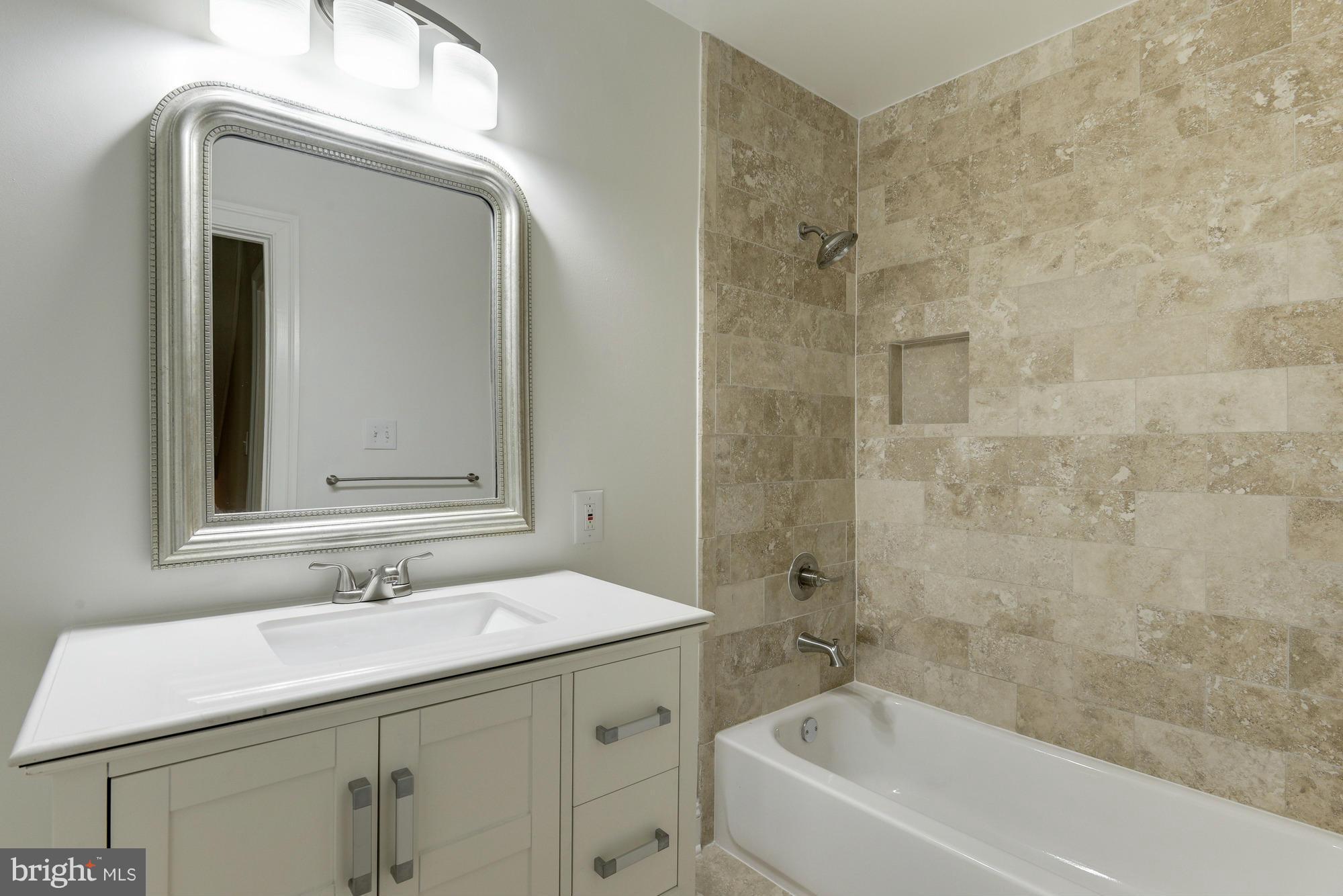 2237 Cartwright Place Reston, VA 20191 - Photo 22 of 25 Large hallway bathroom, travertine marble