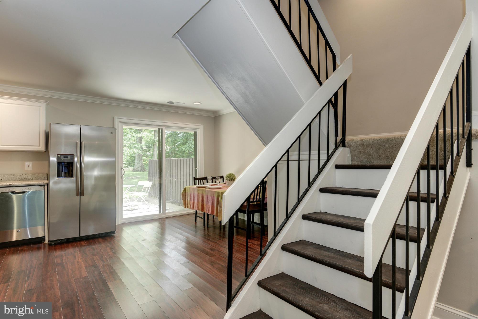 2237 Cartwright Place Reston, VA 20191 - Photo 5 of 25 Open concept kitchen to dining area and patio