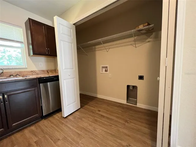 a view of a kitchen from the hallway