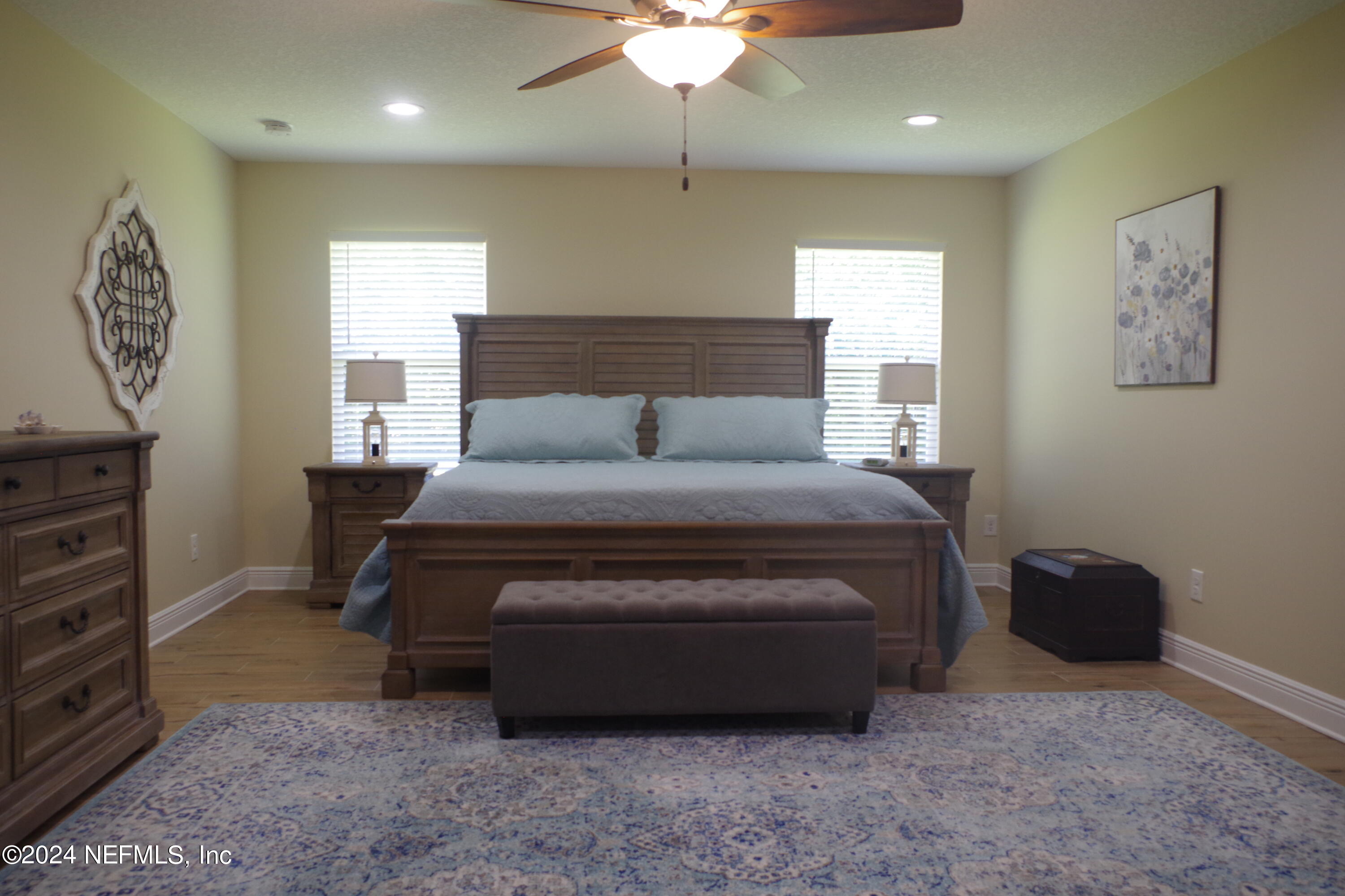 54065 Howard Road Callahan, FL 32011 - Photo 23 of 69 a living room with furniture a bed and a flat screen tv