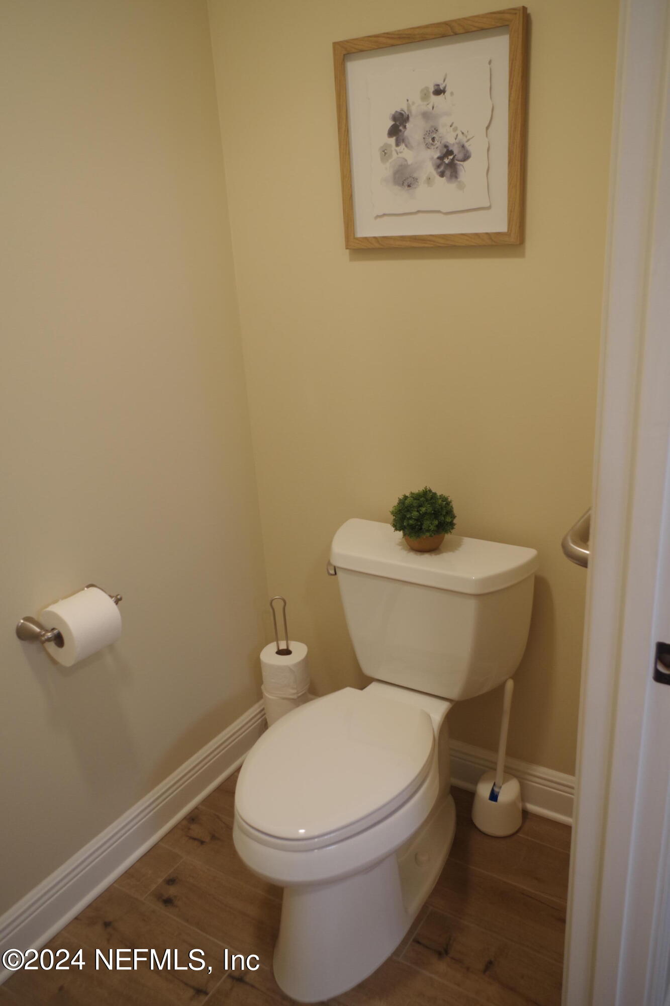 54065 Howard Road Callahan, FL 32011 - Photo 29 of 69 a white toilet sitting next to a bathroom sink