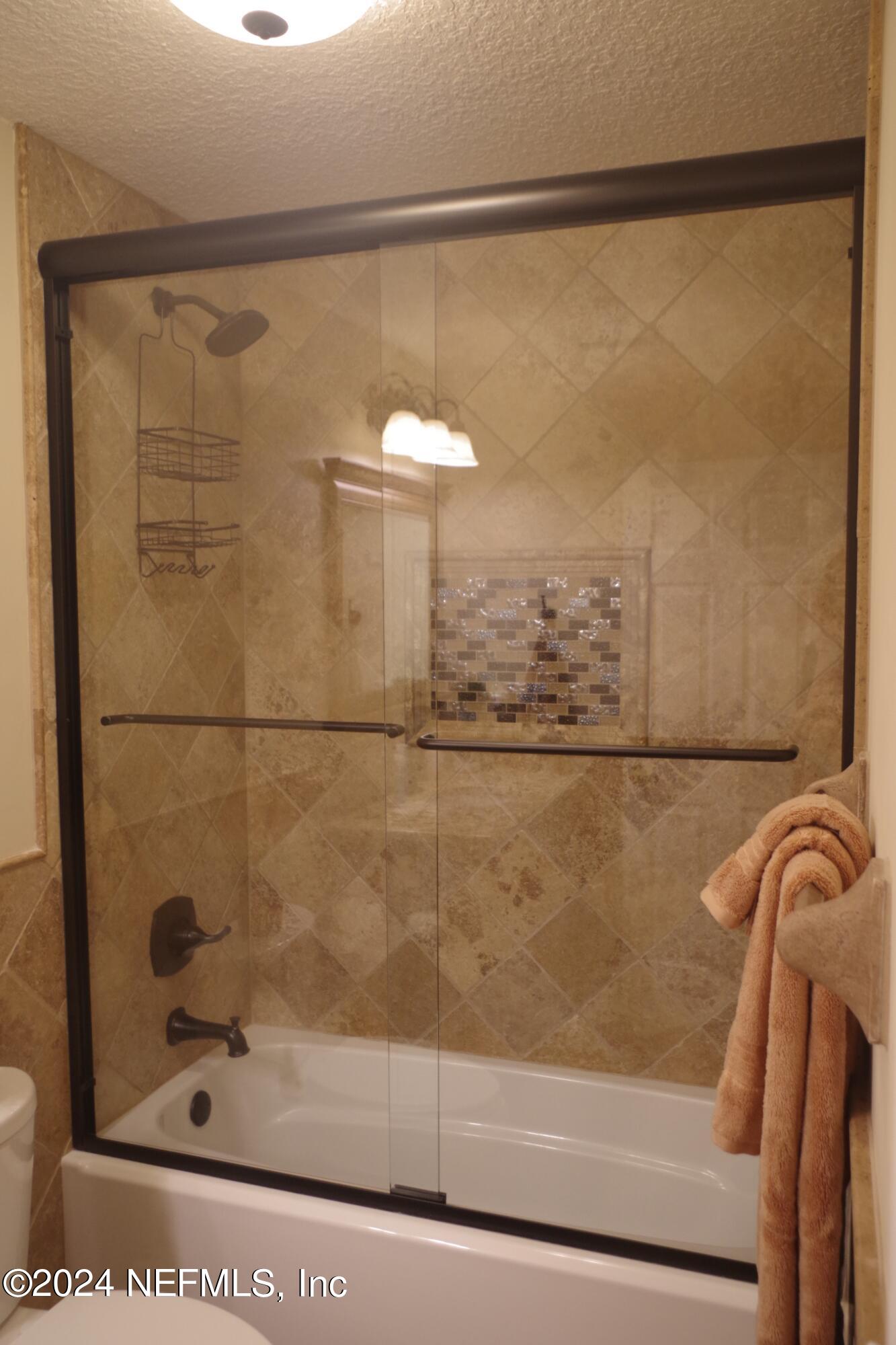 54065 Howard Road Callahan, FL 32011 - Photo 34 of 69 a bathroom with a shower